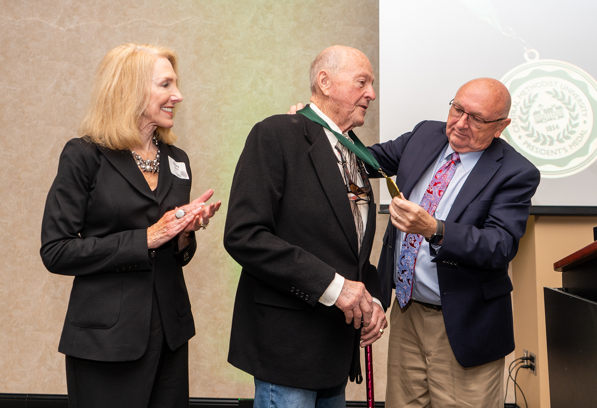 Dr. Roger Drake awards the President's Medal to Earl Bates '61