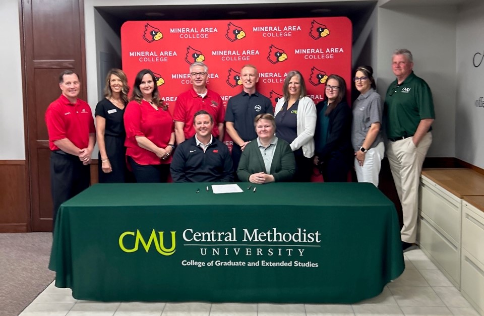 CMU and MAC personnel at signing event