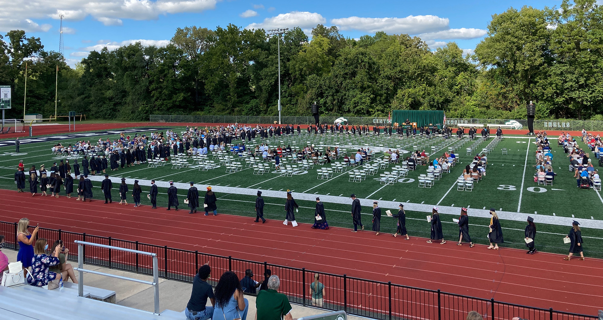 Outdoor commencement at Davis Field