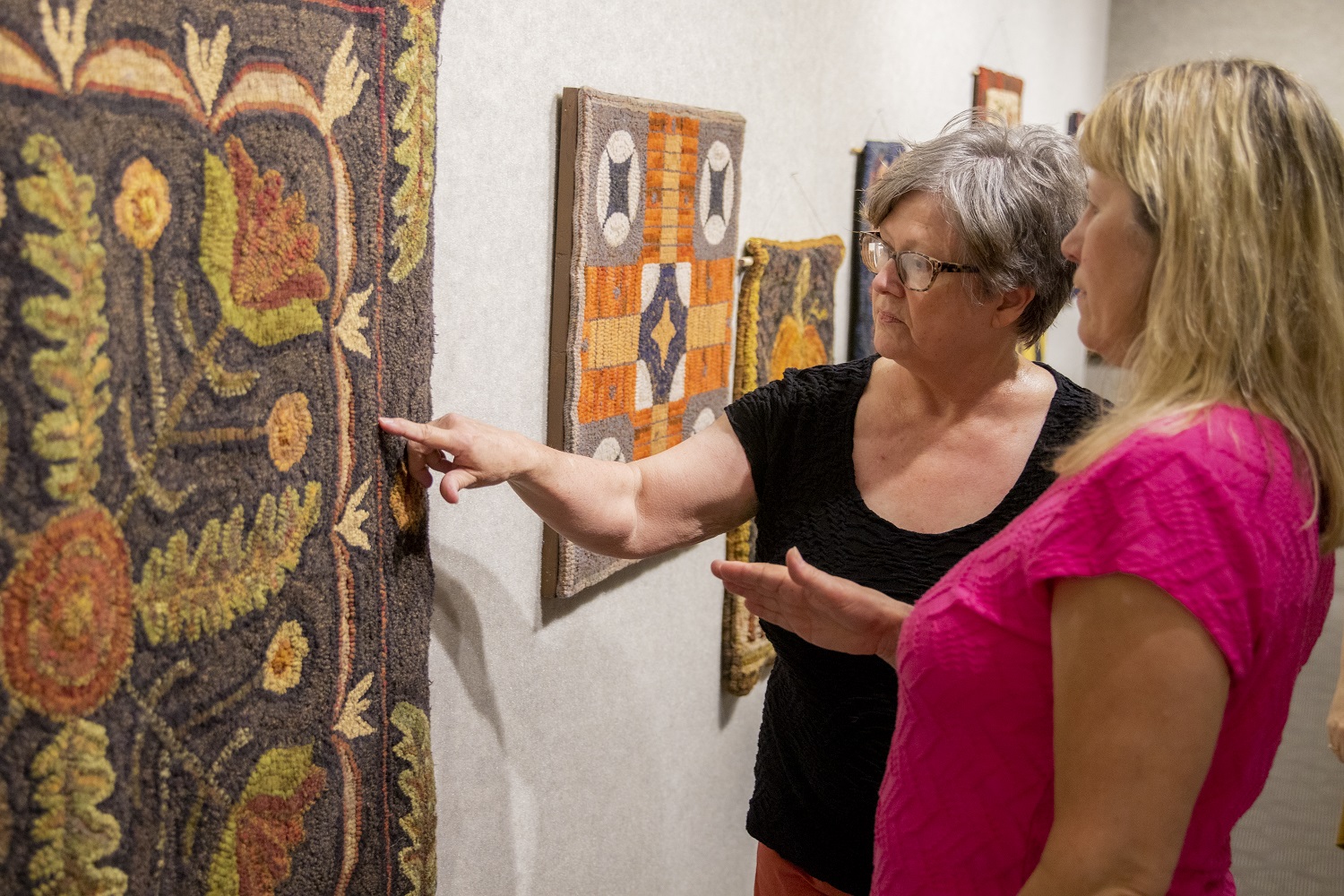 Patrons at the rug exhibit